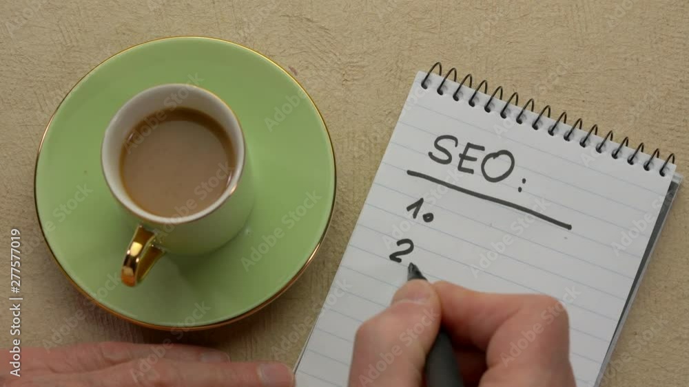 Canvas Prints seo (search engine optimization) list - man hand writing a note with a black marker in a spiral note