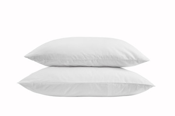 Two white pillows isolated, stack of pillows on a white background, two pillows piled against white background. Side view.