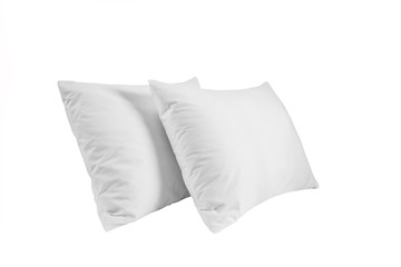 Two white pillows isolated, pillows on a white background, two pillows piled against white background. Side view.