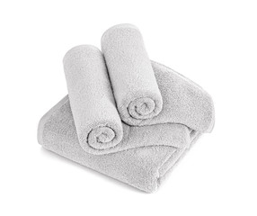 Gray terry towels rolled, folded and stacked isolated.Terry towels against white backdrop. Folded and rolled soft bath towels. Stack of grey cotton towels on a white background top view.
