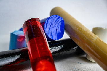 Assorted bar stock of translucent and opaque supplies for glass blowing