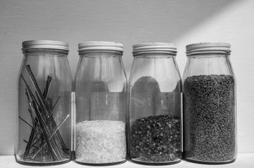 Jars of pulled cane and frit glass blowing supplies
