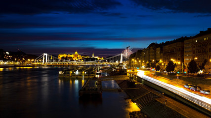 View from Liberty Bridge on the night Danube, Erzhebet Bridge. Fireworks in the night sky