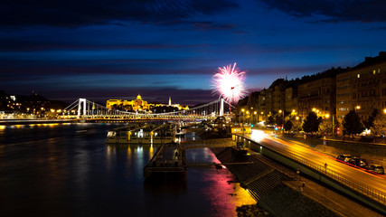 View from Liberty Bridge on the night Danube, Erzhebet Bridge. Fireworks in the night sky