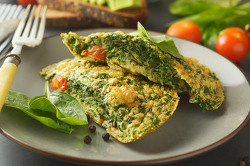 Omelet with spinach leaves. Healthy omelette for lose weight. Healthy food.