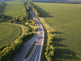 road for cars aerial view from top around green nature