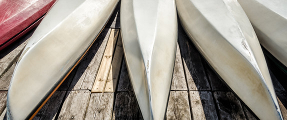 KAYAKS AT THE MARINA - Recreational boats on the boards of the jetty