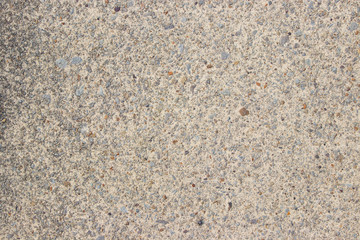 Beige stone pebble wall texture