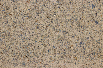 Beige stone pebble wall texture