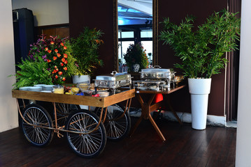 cart with flowers and food