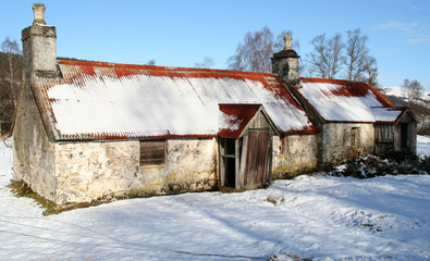 Abandoned and derelict croft in a remote rural area of Scotland in winter. © George Green