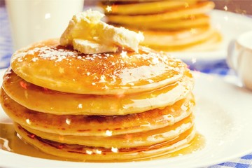 Stack of delicious pancakes with butter