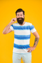 Summer vacation. Summer style. Cheerful sailor. Join my wave. Guy dressed striped shirt on summer vacation. Barbershop concept. Man bearded hipster with mustache and long beard on yellow background