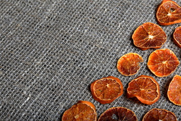 Dried orange slices for decoration. Laid out on a rough linen fabric
