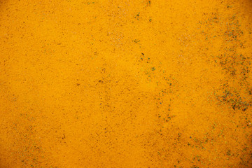 Yellow grunge painted wall texture