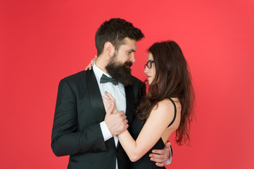 Lets dance tonight. Elegant couple in love tender hug dancing red background. Happy together. Man in tuxedo and woman black dress dancing at party. Passionate couple dancing. Feel rhythm of heart