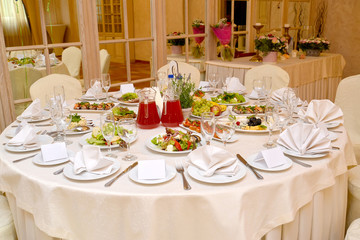 The round table served for a banquet. Restaurant