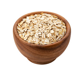 Oat flakes in wooden bowl isolated on white background