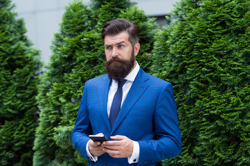 modern look of ceo. responding email. always online. have some problems. serious businessman with...