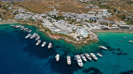 Aerial panoramic photo of famous turquoise clear sea celebrity sandy beach and bay of Psarou with...