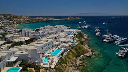 Aerial panoramic photo of famous turquoise clear sea celebrity sandy beach and bay of Psarou with...