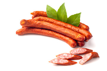 Dry smoked Sausages with basil leaves, macro, isolated on white background.
