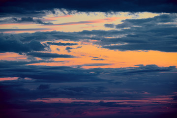 Beautiful sunset - dark sky with clouds and sunlight