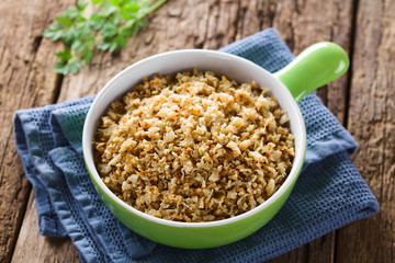 Fresh homemade roasted or fried cauliflower rice in bowl (Selective Focus, Focus one third into the bowl)