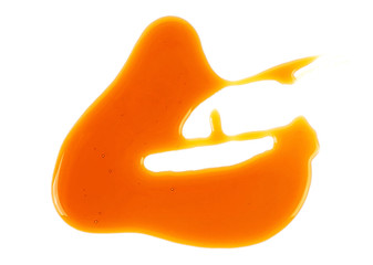 Flowing sweet caramel sauce isolated on a white background. Liquid caramel.