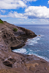 Fototapeta na wymiar Spitting Cave of Portlock on Oahu Island of Hawaii. Known for many cliff jumpers who have lost their lives there.