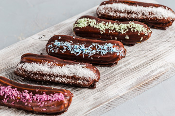 chocolate éclairs with colored powder