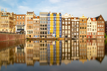 Amsterdam historic facades reflecting in the water