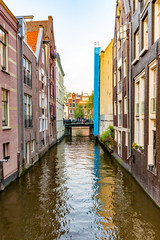 Fototapeta na wymiar typical narrow Amsterdam canal buildings