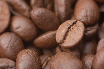 Coffee beans. Extreme closeup of coffee beans roasted. Coffee concept.