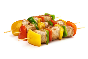 Shish Kebab - grilled pork sausage skewers and vegetables BBQ, close-up, isolated on white background