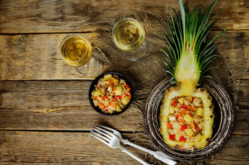 Bacon chicken pine apple vegetables fried rice in pineapples