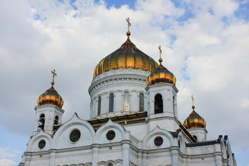 Fototapeta na wymiar Cathedral of Christ the Saviour in Moscow, Russia. Orthodox church in Moscow city center close up view of facade with golden domes