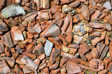 construction rubble of old red tiles gives a harmonic background