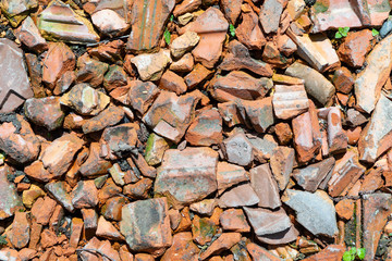 construction rubble of old red tiles gives a harmonic background