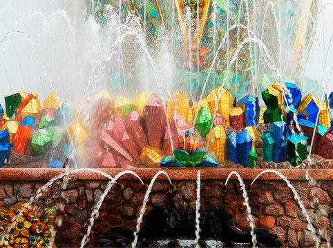 Horizontal colorful fountain at VDNKh architecture background