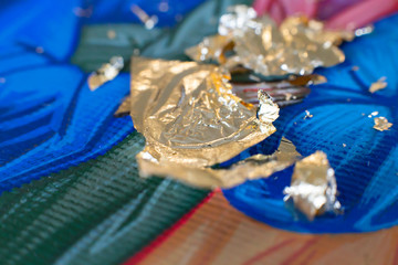 Gilding theme with a leaf of beaten gold and blade