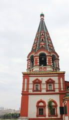 Fototapeta na wymiar Bell tower of St Basil's Cathedral on Red Square in Moscow, Russia. Ornamental decorative tower of famous russian church in capital city of Moscow