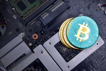 golden bitcoins with flag of kazakhstan on a computer electronic circuit board. bitcoin mining...