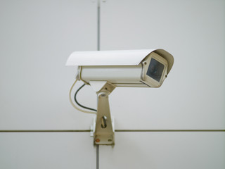 Outdoor surveillance camera mounted on the wall