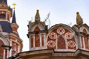 Fototapeta premium Gothic Orthodox Cathedral. Neo-Gothic Orthodox Church with Masonic symbols. Five-pointed star in a circle on the bas-relief of the temple.