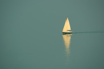 Aerial view of white sailboat leaving in the Balaton lake