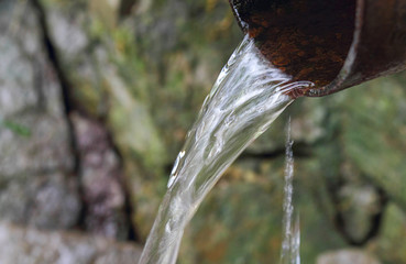 Transparent fresh spring water, current water. Water on stones. Take care of nature while traveling...