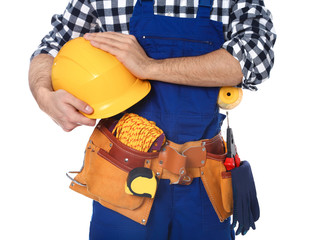 Construction worker with tool belt on white background, closeup