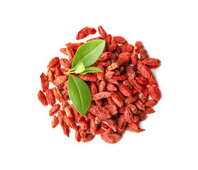 Pile of dried goji berries and leaves on white background, top view