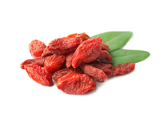Pile of dried goji berries and leaves on white background